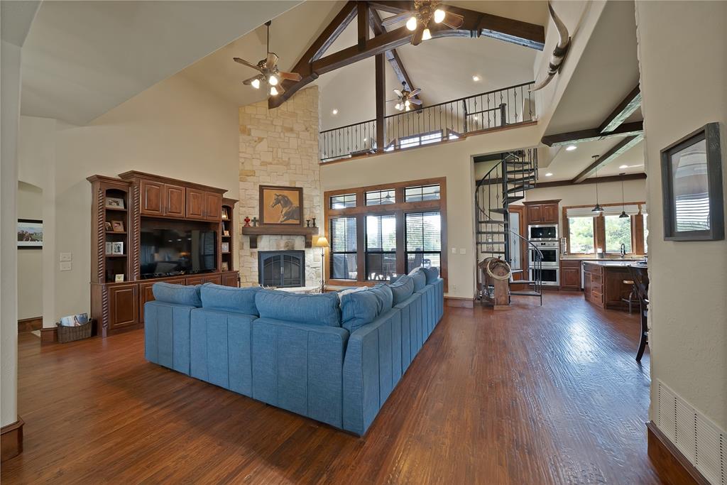 7421 Dawn Avenue Pilot Point, TX 76258 - Photo 12 of 40 a living room with furniture and a fireplace
