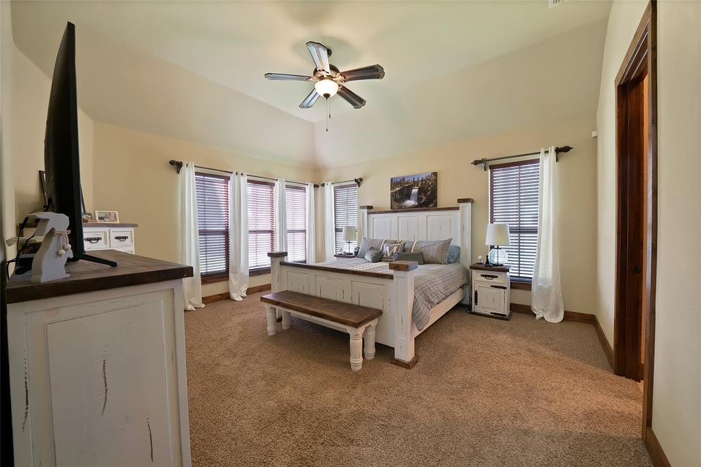 7421 Dawn Avenue Pilot Point, TX 76258 - Photo 20 of 40 a bed room with a bed and a television
