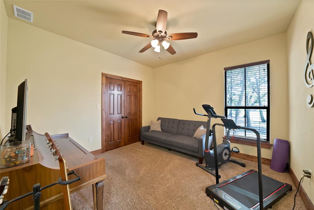 7421 Dawn Avenue Pilot Point, TX 76258 - Photo 24 of 40 a living room with furniture and a window