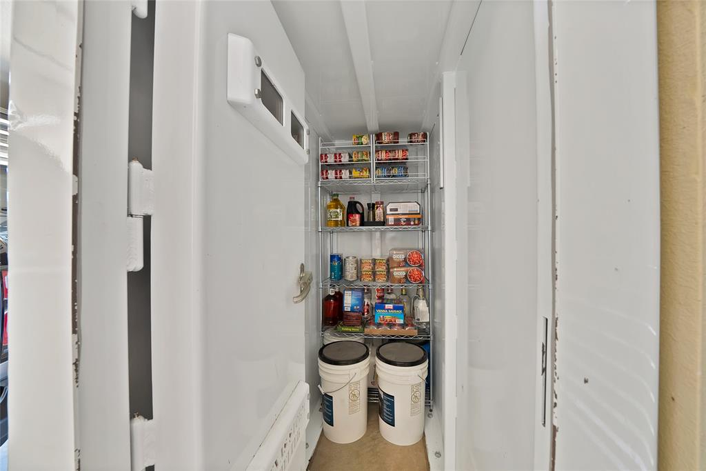 7421 Dawn Avenue Pilot Point, TX 76258 - Photo 30 of 40 a room with a baby crib and a table