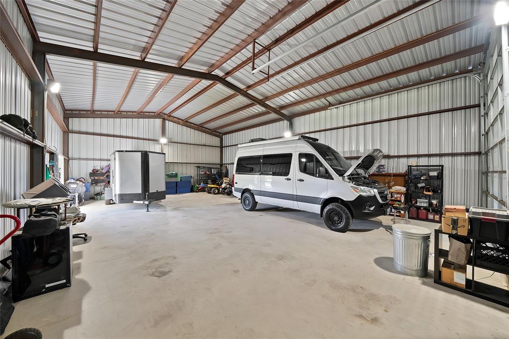 7421 Dawn Avenue Pilot Point, TX 76258 - Photo 32 of 40 a view of parking garage with cars