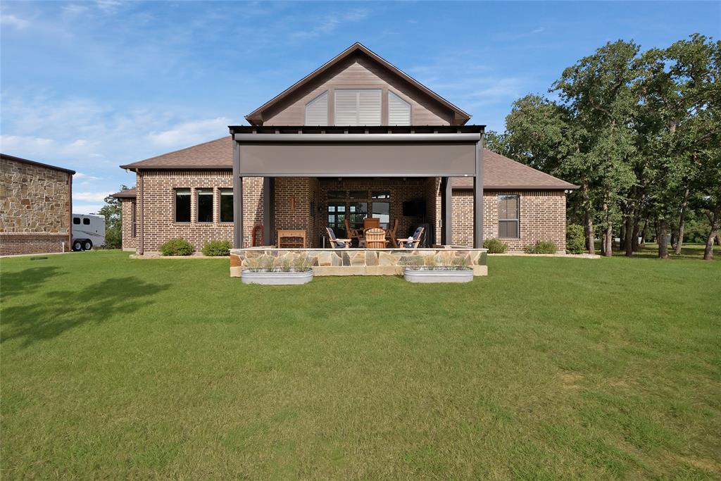 7421 Dawn Avenue Pilot Point, TX 76258 - Photo 35 of 40 a front view of house with yard and green space