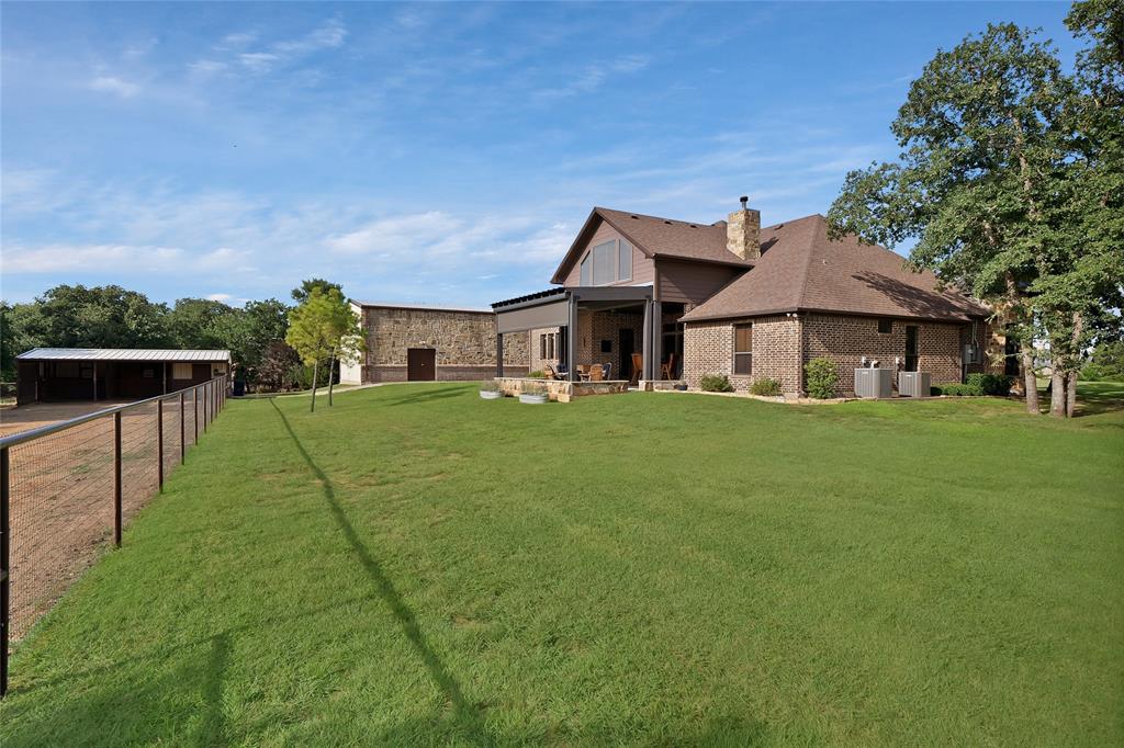 7421 Dawn Avenue Pilot Point, TX 76258 - Photo 36 of 40 a front view of a house with a yard