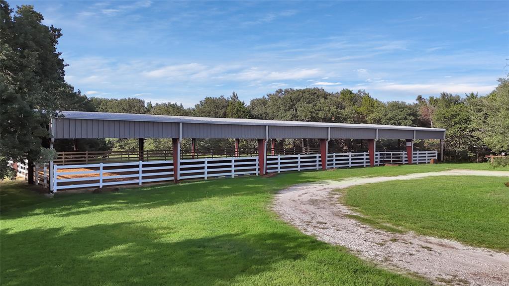 7421 Dawn Avenue Pilot Point, TX 76258 - Photo 39 of 40 a view of a house with a yard in a garden