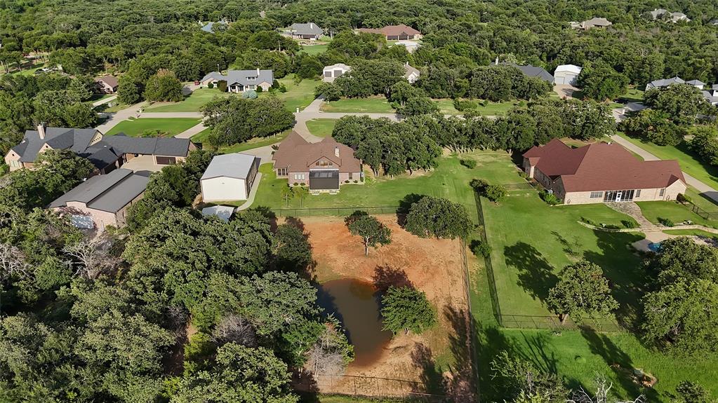 7421 Dawn Avenue Pilot Point, TX 76258 - Photo 9 of 40 an aerial view of residential house with outdoor space and trees all around