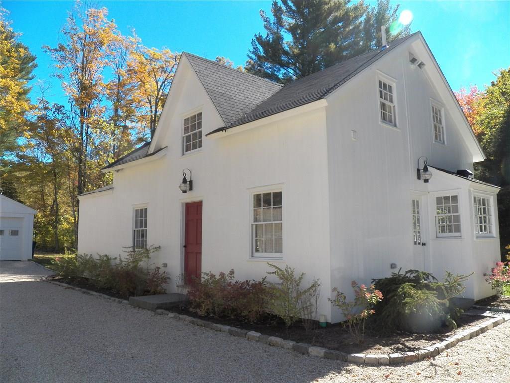 61 Wykeham Road Washington, CT 06793 - Photo 1 of 1 a front view of a house with a yard