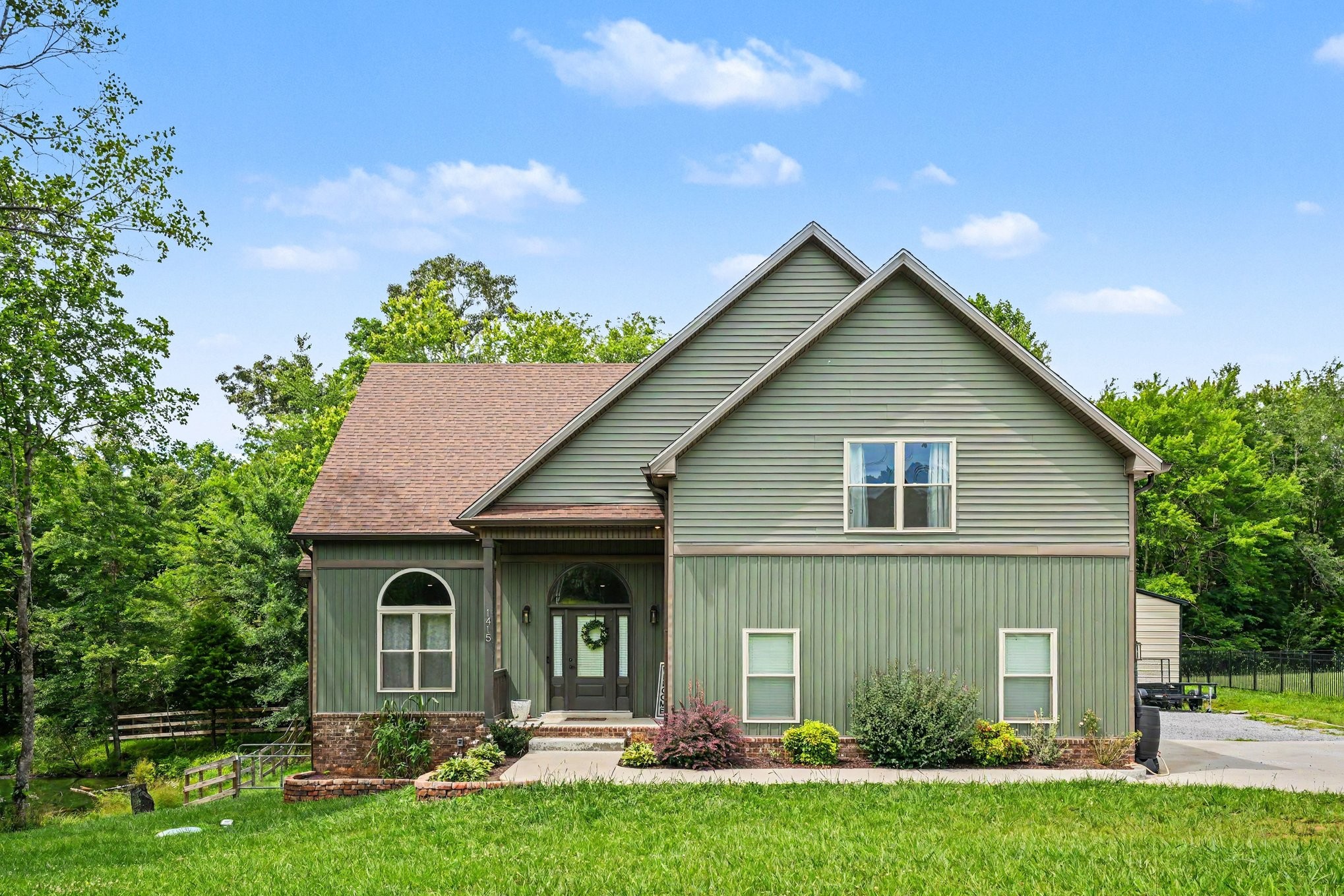 1415 Southside Road Southside, TN 37171 - Photo 2 of 35 a front view of house with yard and green space