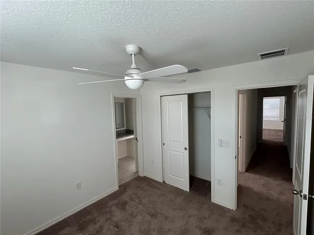 an empty room with a bathroom