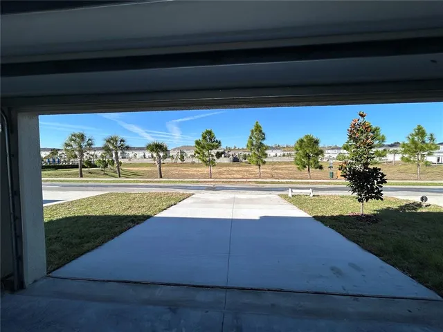 a view of swimming pool with a yard and mountain view