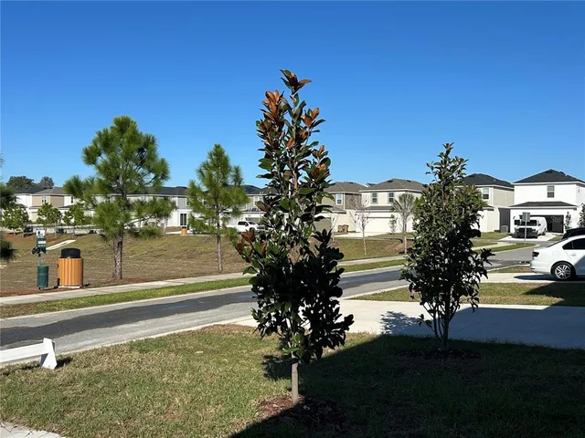 a view of a house with flower garden