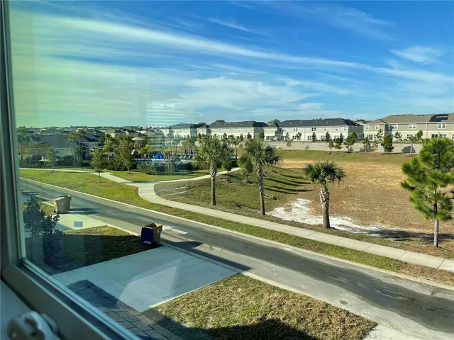 a view of a swimming pool and an outdoor seating