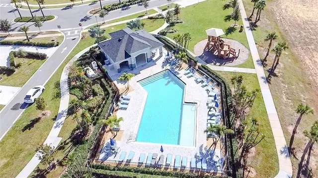 a view of a swimming pool with a lounge chairs