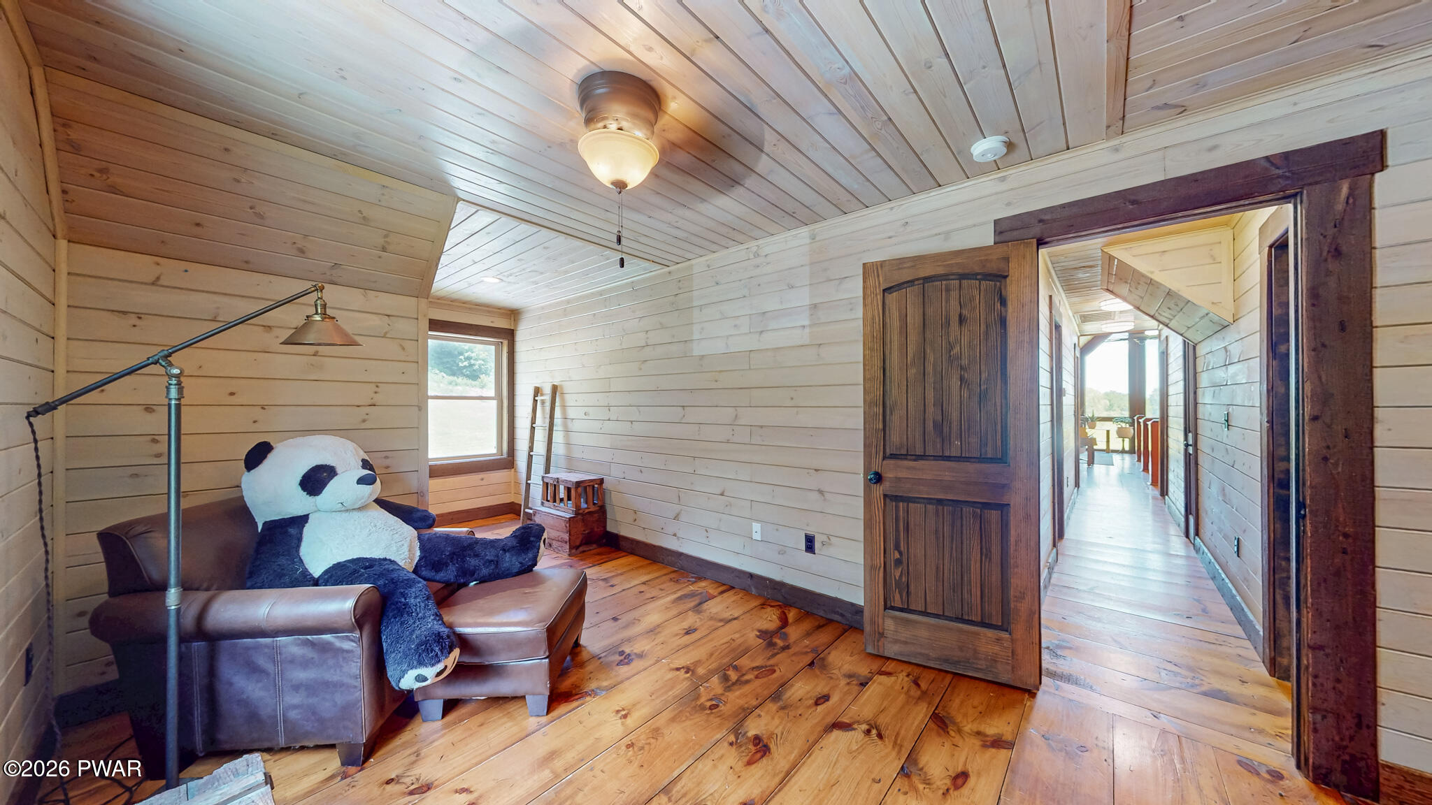 149 Sheards Road Milanville, PA 18443 - Photo 42 of 57 a room with wooden furniture and two windows