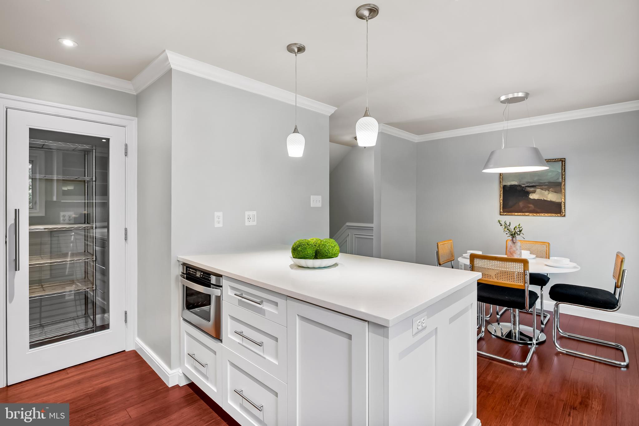 254 Robert Street Baltimore, MD 21217 - Photo 18 of 31 a kitchen with a table and chairs