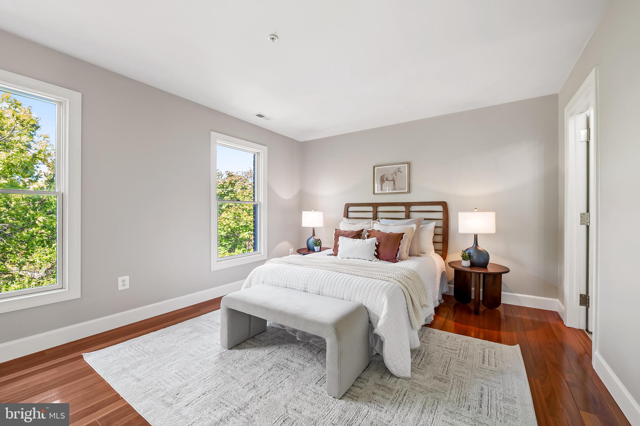 254 Robert Street Baltimore, MD 21217 - Photo 25 of 31 a bedroom with a bed and wooden floor