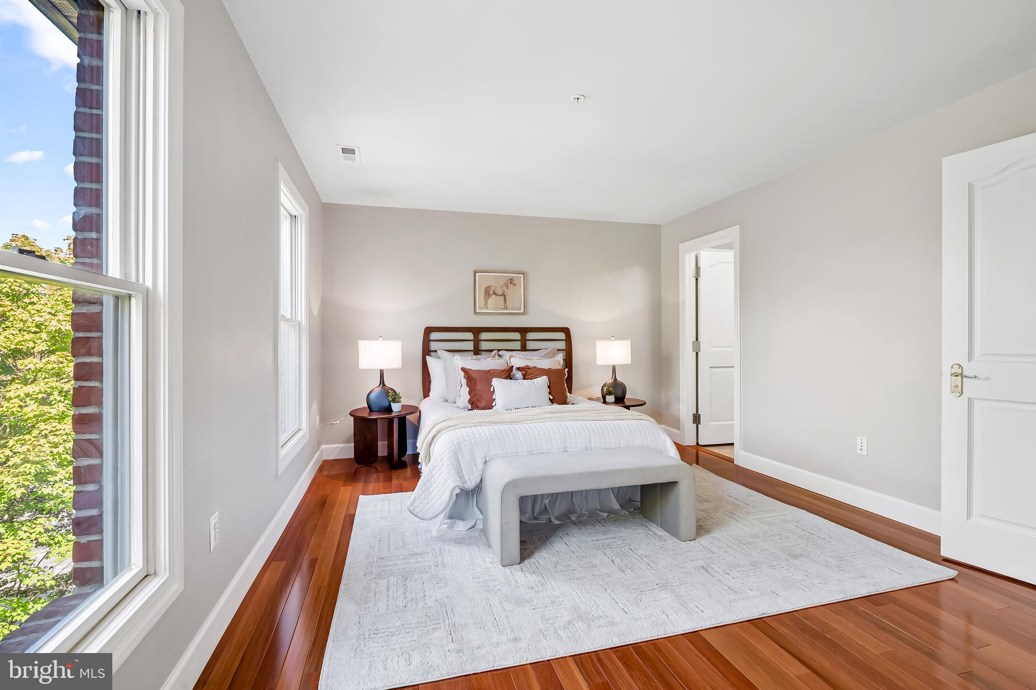 254 Robert Street Baltimore, MD 21217 - Photo 26 of 31 a bedroom with a bed and wooden floor