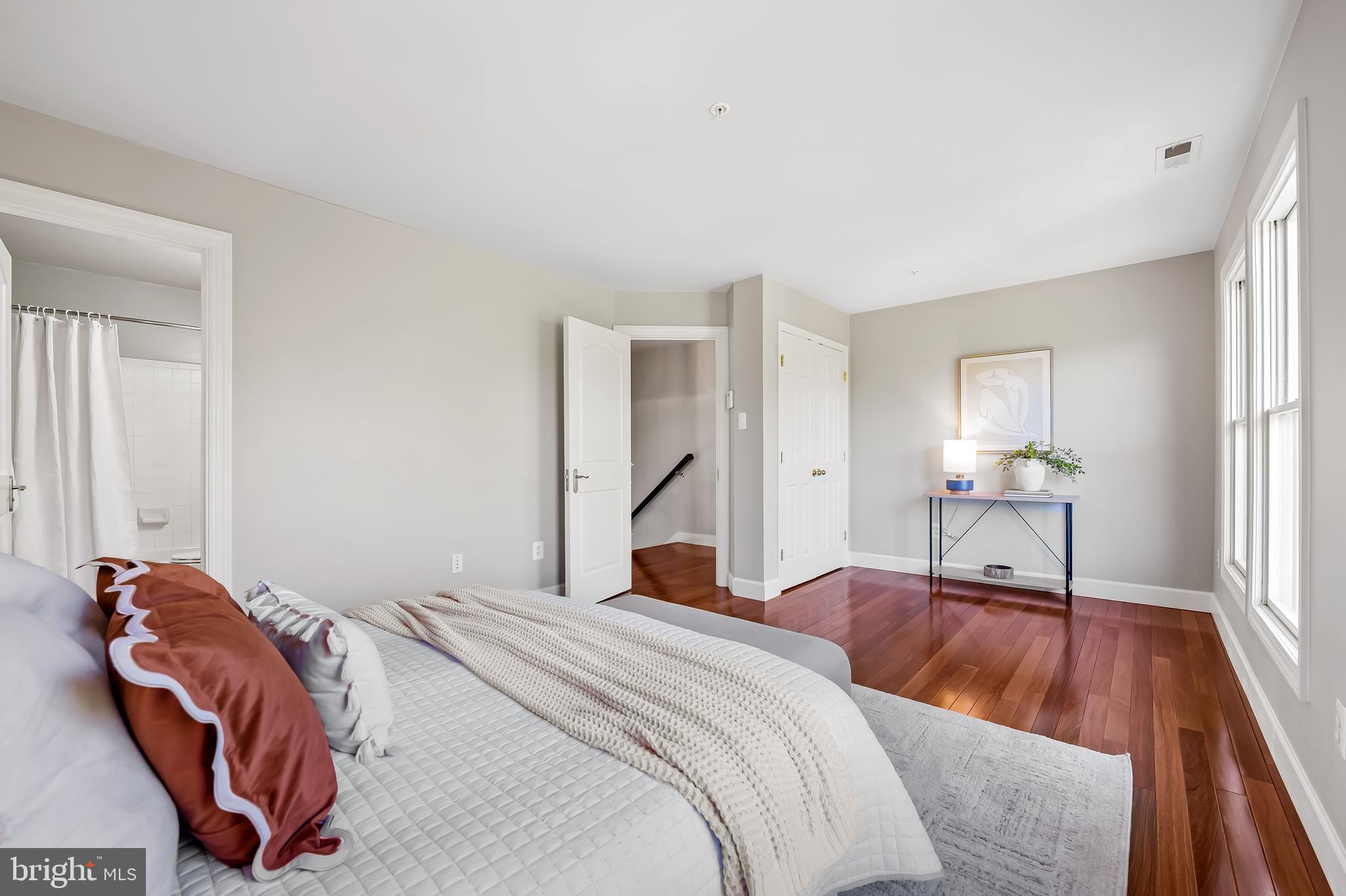 254 Robert Street Baltimore, MD 21217 - Photo 27 of 31 a bedroom with a bed and a large mirror