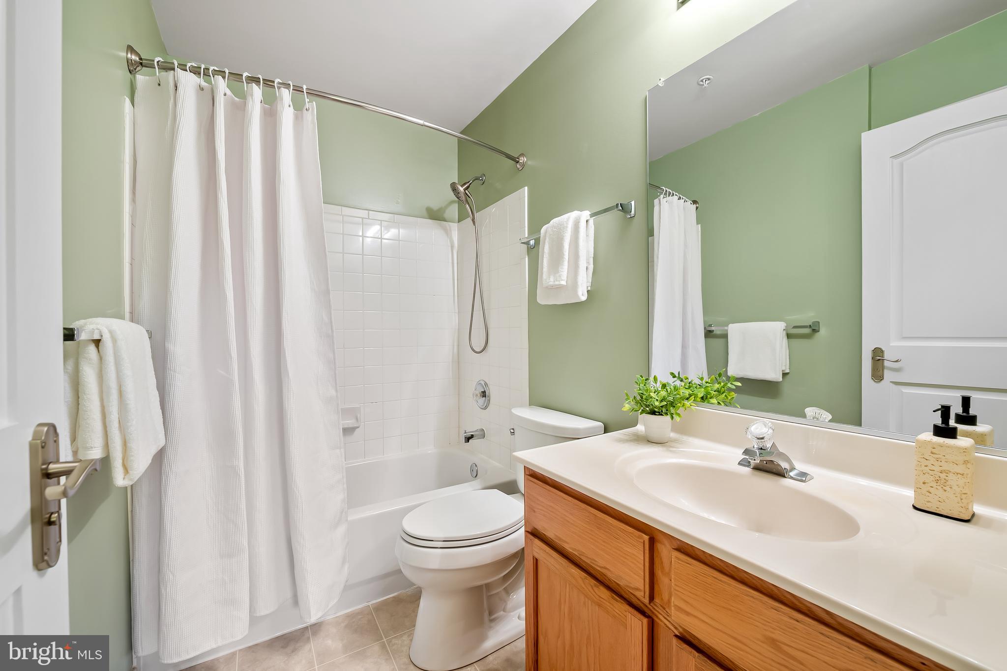 254 Robert Street Baltimore, MD 21217 - Photo 28 of 31 a bathroom with a sink a toilet and shower