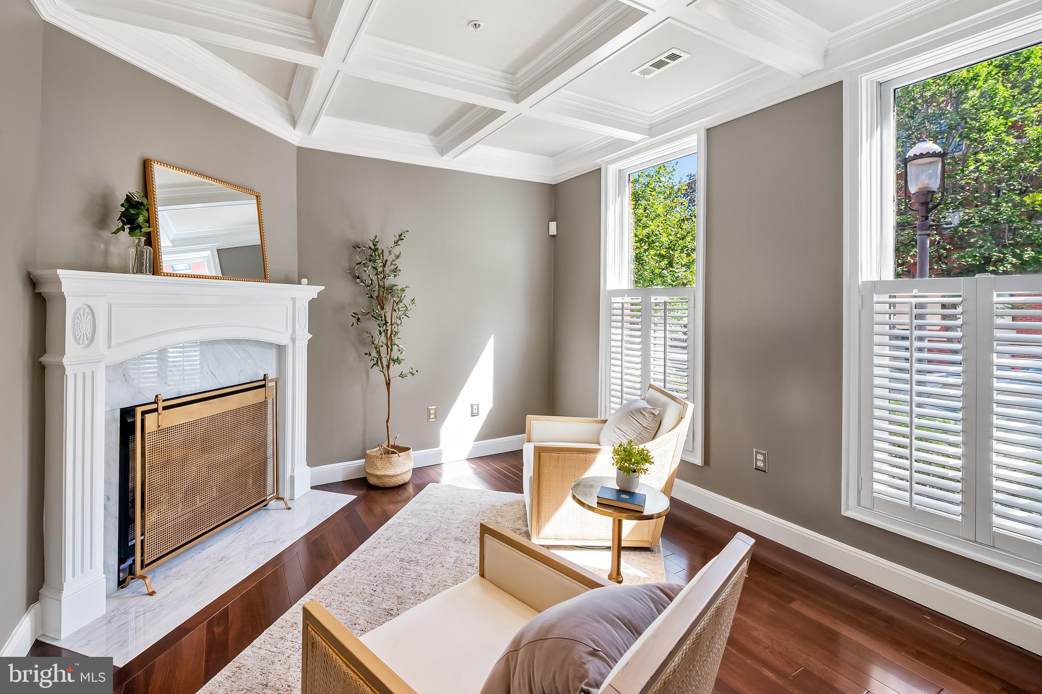 254 Robert Street Baltimore, MD 21217 - Photo 6 of 31 a living room with furniture a fireplace and a large window