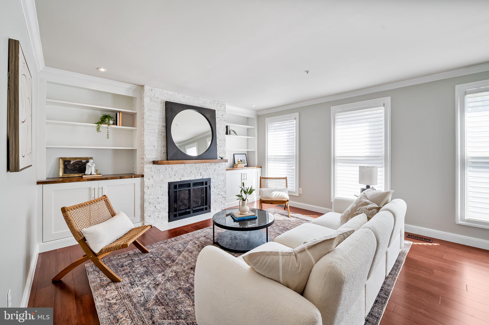 254 Robert Street Baltimore, MD 21217 - Photo 9 of 31 a living room with furniture a fireplace and window