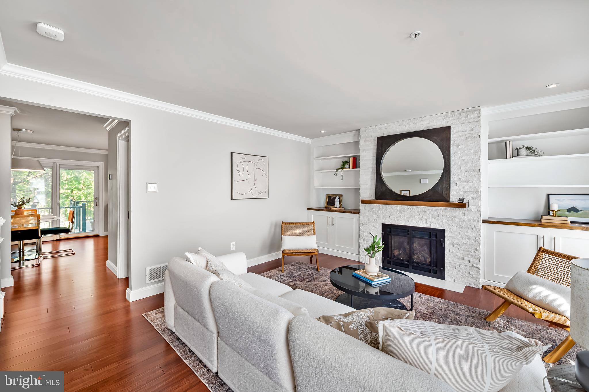 254 Robert Street Baltimore, MD 21217 - Photo 10 of 31 a living room with furniture a flat screen tv and a fireplace