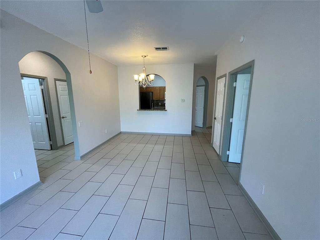 13548 Turtle Marsh Loop, Unit 427 Orlando, FL 32837 - Photo 16 of 34 a view of a livingroom with a staircase