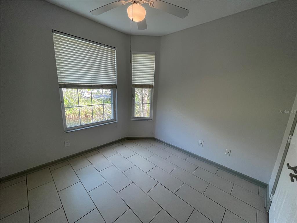 13548 Turtle Marsh Loop, Unit 427 Orlando, FL 32837 - Photo 21 of 34 an empty room with windows