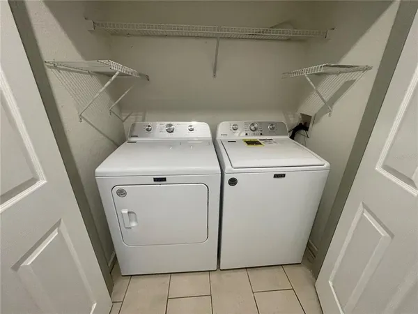 a utility room with dryer and washer