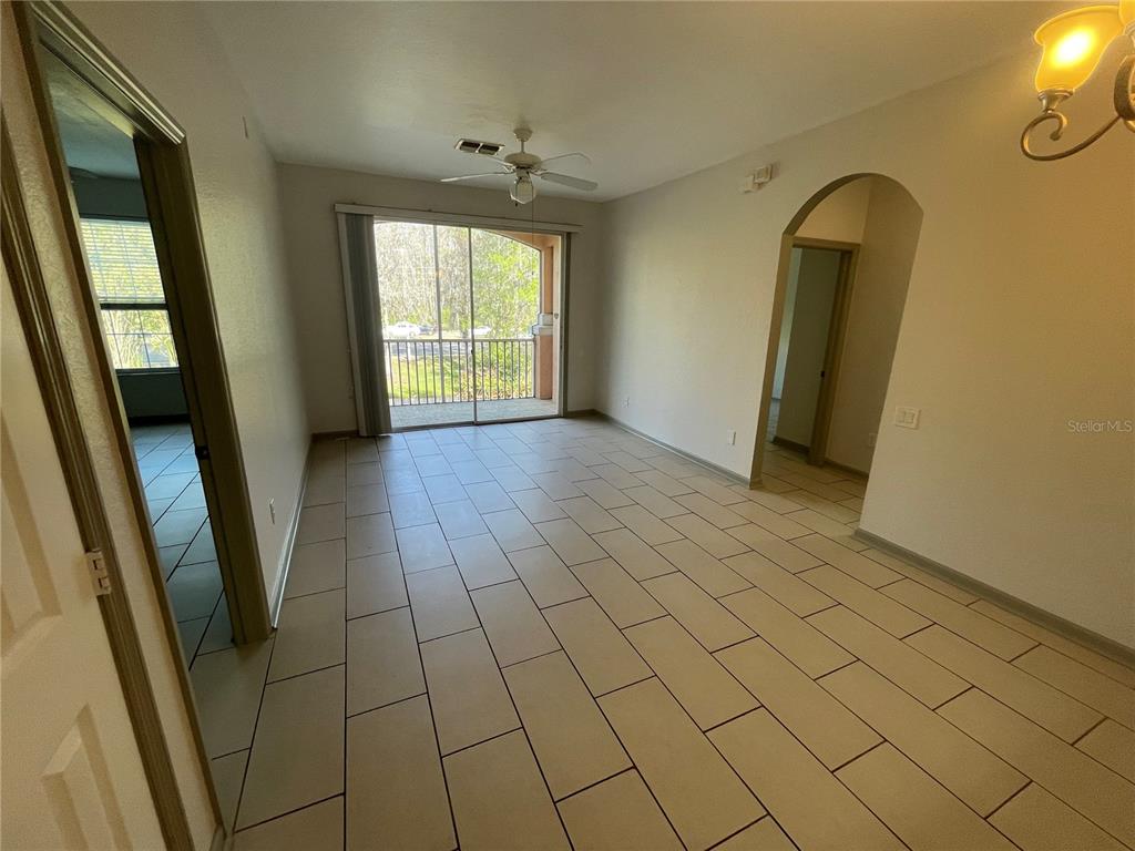 13548 Turtle Marsh Loop, Unit 427 Orlando, FL 32837 - Photo 24 of 34 an empty room with windows