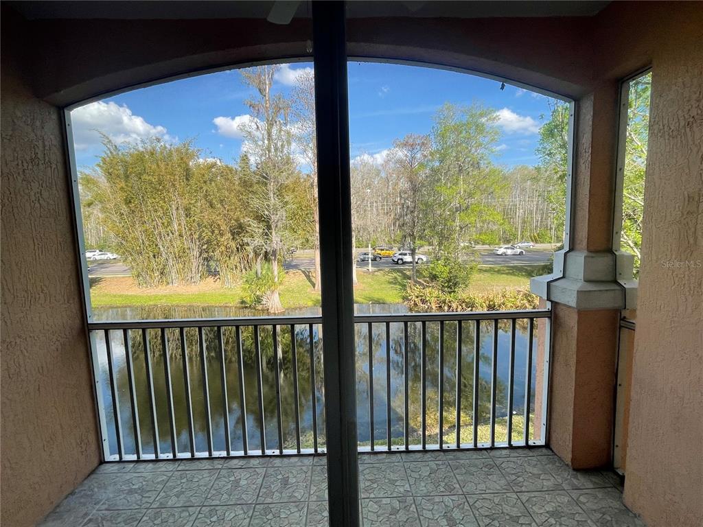 13548 Turtle Marsh Loop, Unit 427 Orlando, FL 32837 - Photo 26 of 34 a view of a glass door with a large window