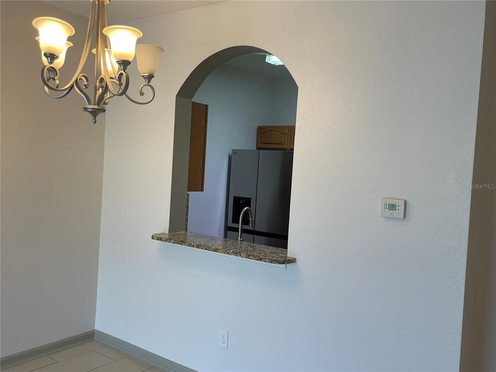 13548 Turtle Marsh Loop, Unit 427 Orlando, FL 32837 - Photo 27 of 34 a view of a livingroom with a mirror