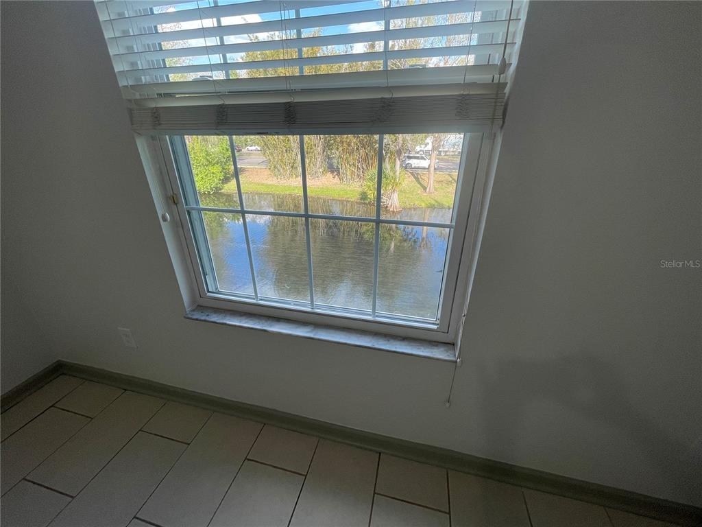 13548 Turtle Marsh Loop, Unit 427 Orlando, FL 32837 - Photo 10 of 34 a view of a window in a room