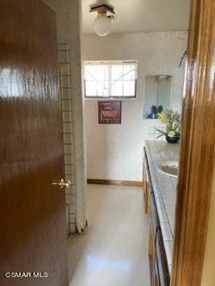 23381 Angus Court Tehachapi, CA 93561 - Photo 5 of 8 a bathroom with a sink a mirror and shower