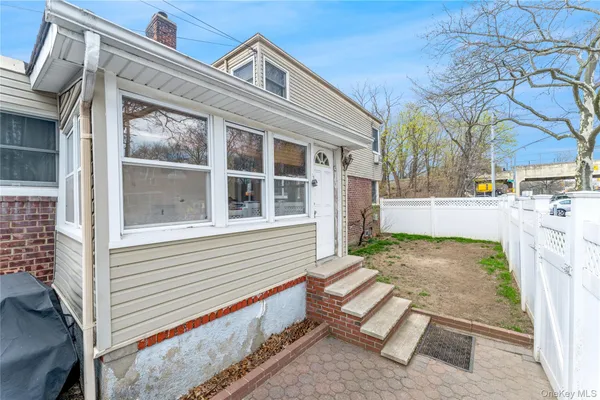 a view of a patio with chair and table and chairs