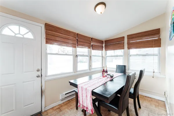 a view of a dining room with furniture window and outside view