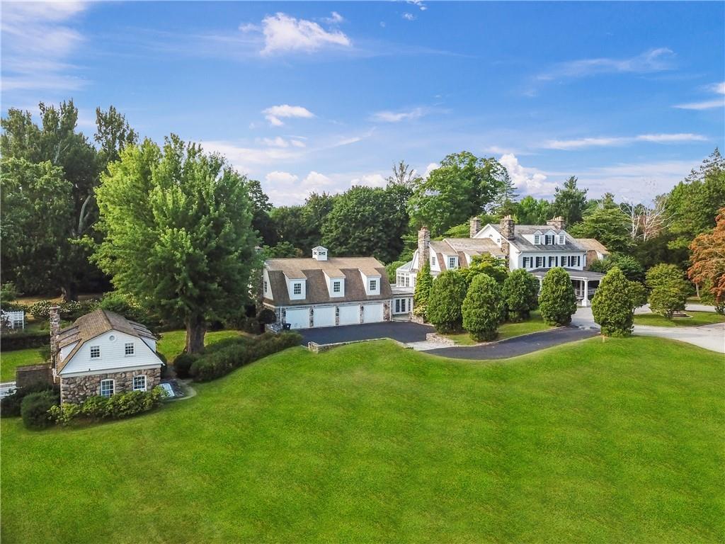 2007 A/b Purchase Street Harrison, NY 10577 - Photo 3 of 50 a view of a big house with a big yard and large trees
