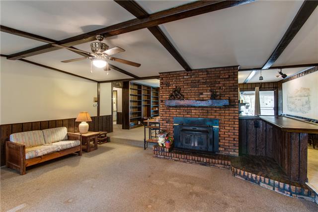 6085 Alvin Sperry Road Mount Juliet, TN 37122 - Photo 3 of 20 open living area with double sided wood burning fireplace