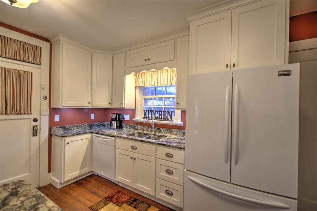 266 Cobb Avenue Decatur, IL 62522 - Photo 18 of 35 a kitchen with a sink dishwasher window and cabinets