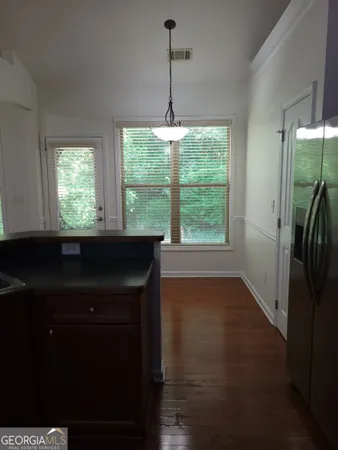 a view of a kitchen from the hallway