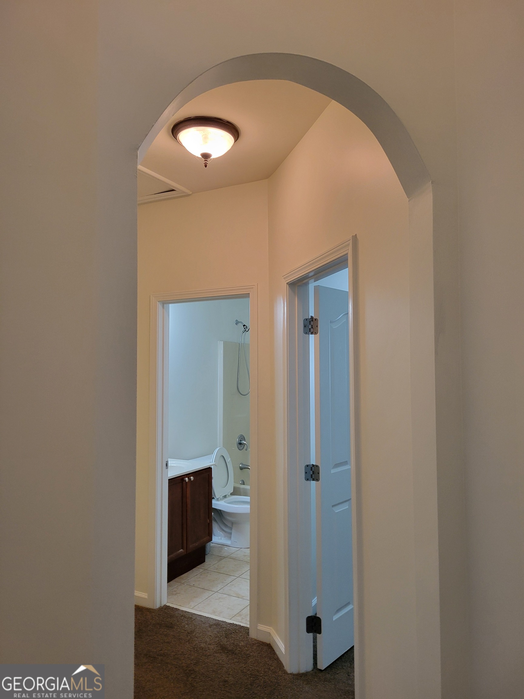 175 Spinner Drive Jefferson, GA 30549 - Photo 21 of 34 a view of a hallway with wooden shelves