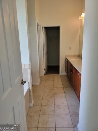 a bathroom with a sink a toilet and a shower