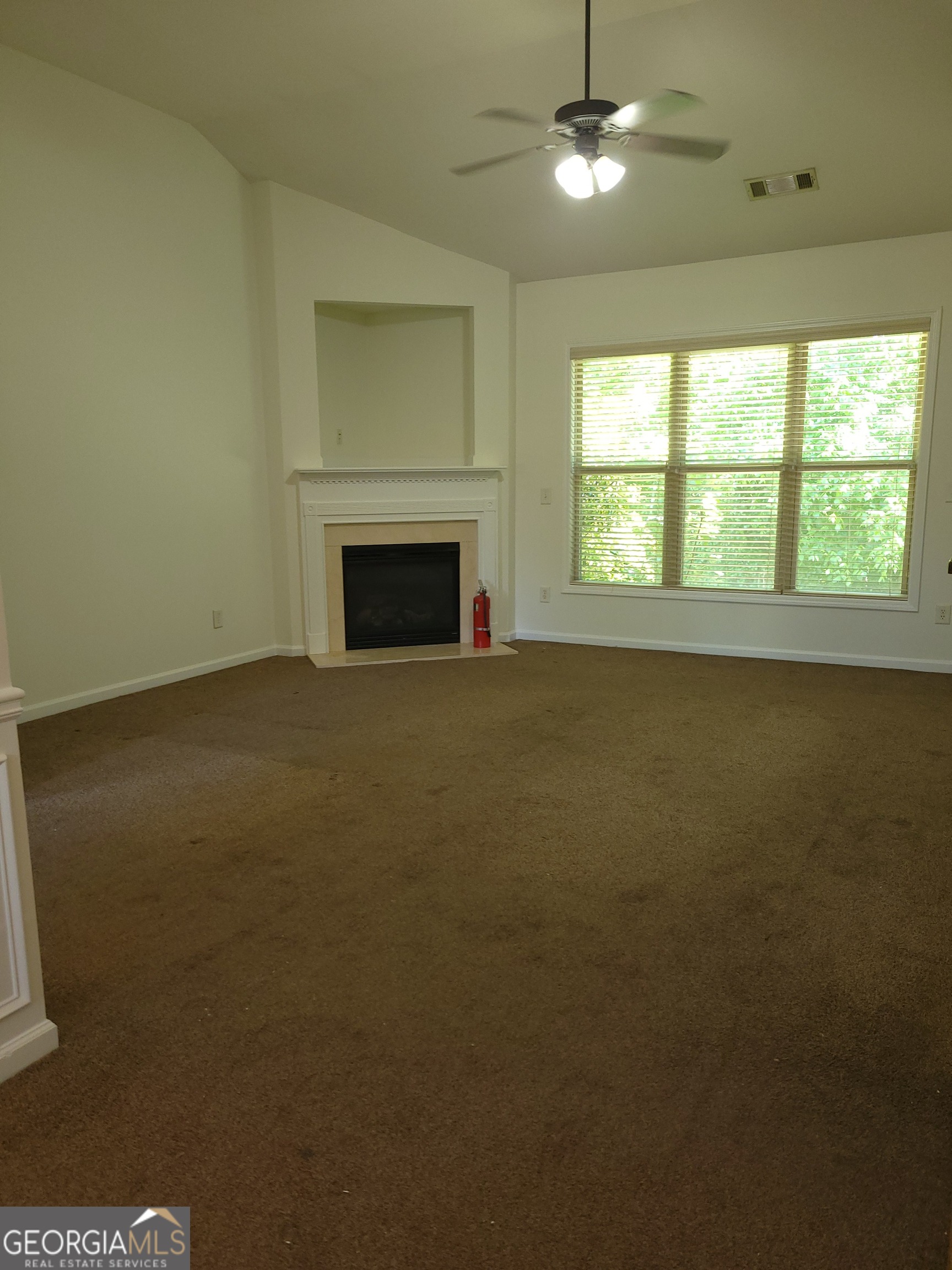 175 Spinner Drive Jefferson, GA 30549 - Photo 3 of 34 a view of empty room with a fireplace