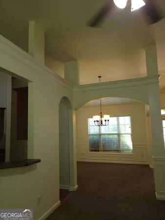 a room with window and a ceiling fan