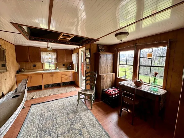 a living room with furniture fireplace and a large window