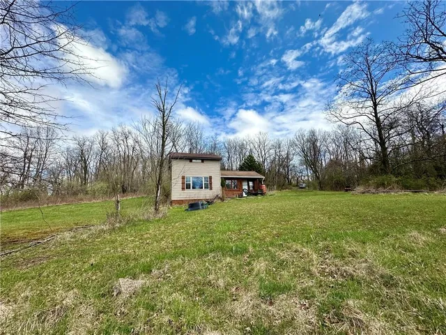 a view of a house with a yard