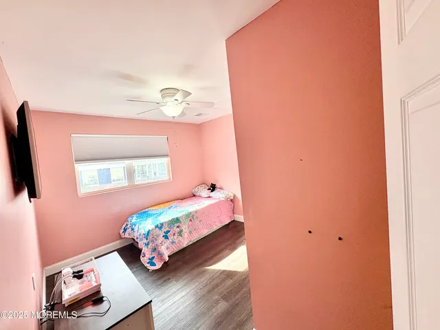 a bedroom with bed and a window