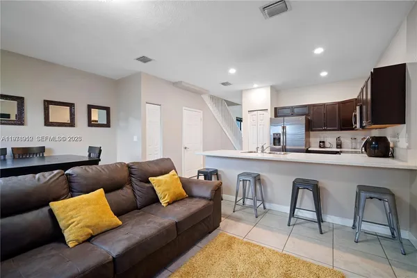 a living room with furniture and a fireplace