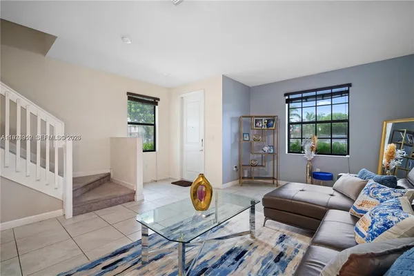 a living room with furniture and a window