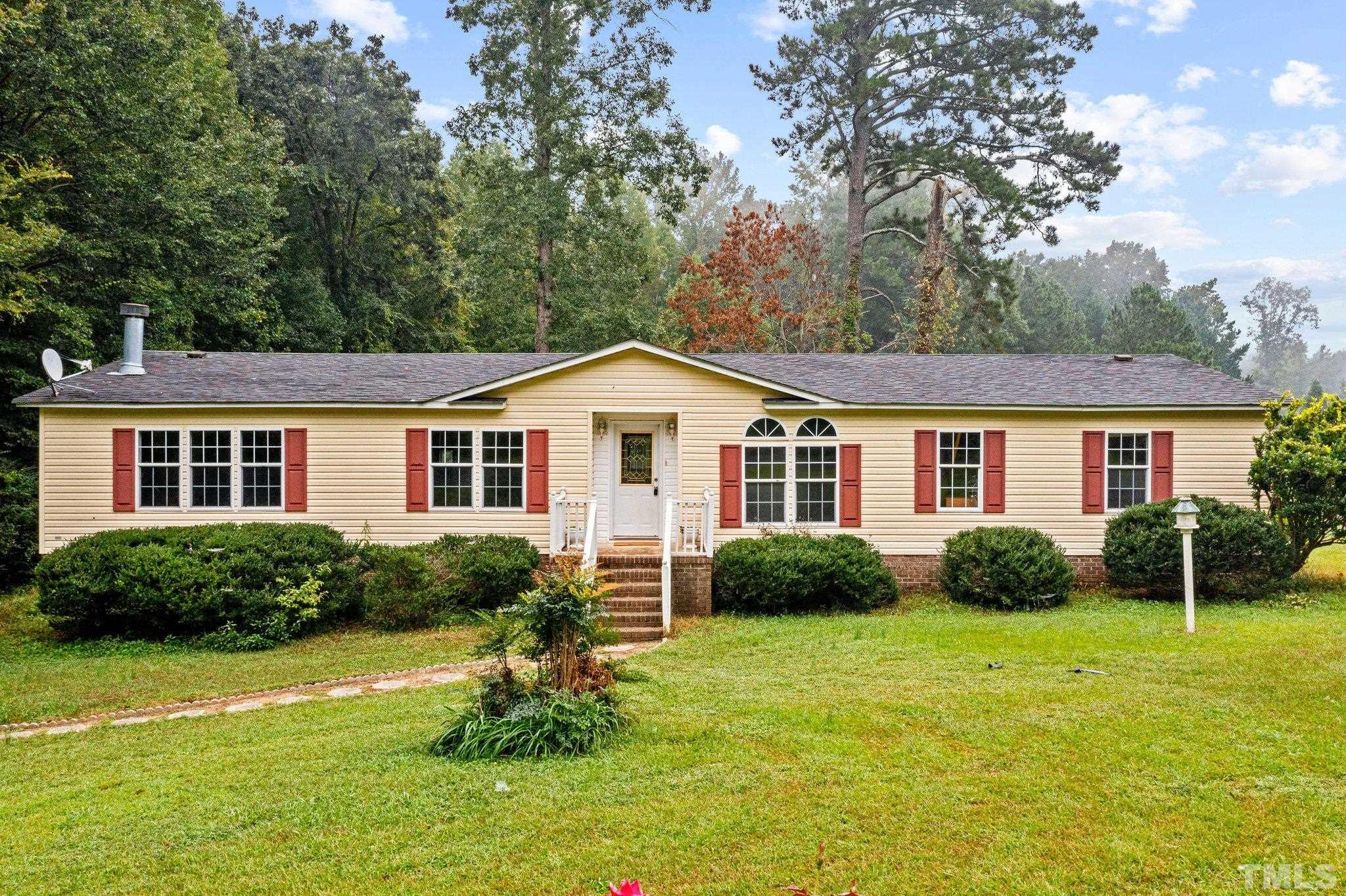 9617 Jernigan Road Spring Hope, NC 27882 - Photo 1 of 41 a view of a house with a yard and plants