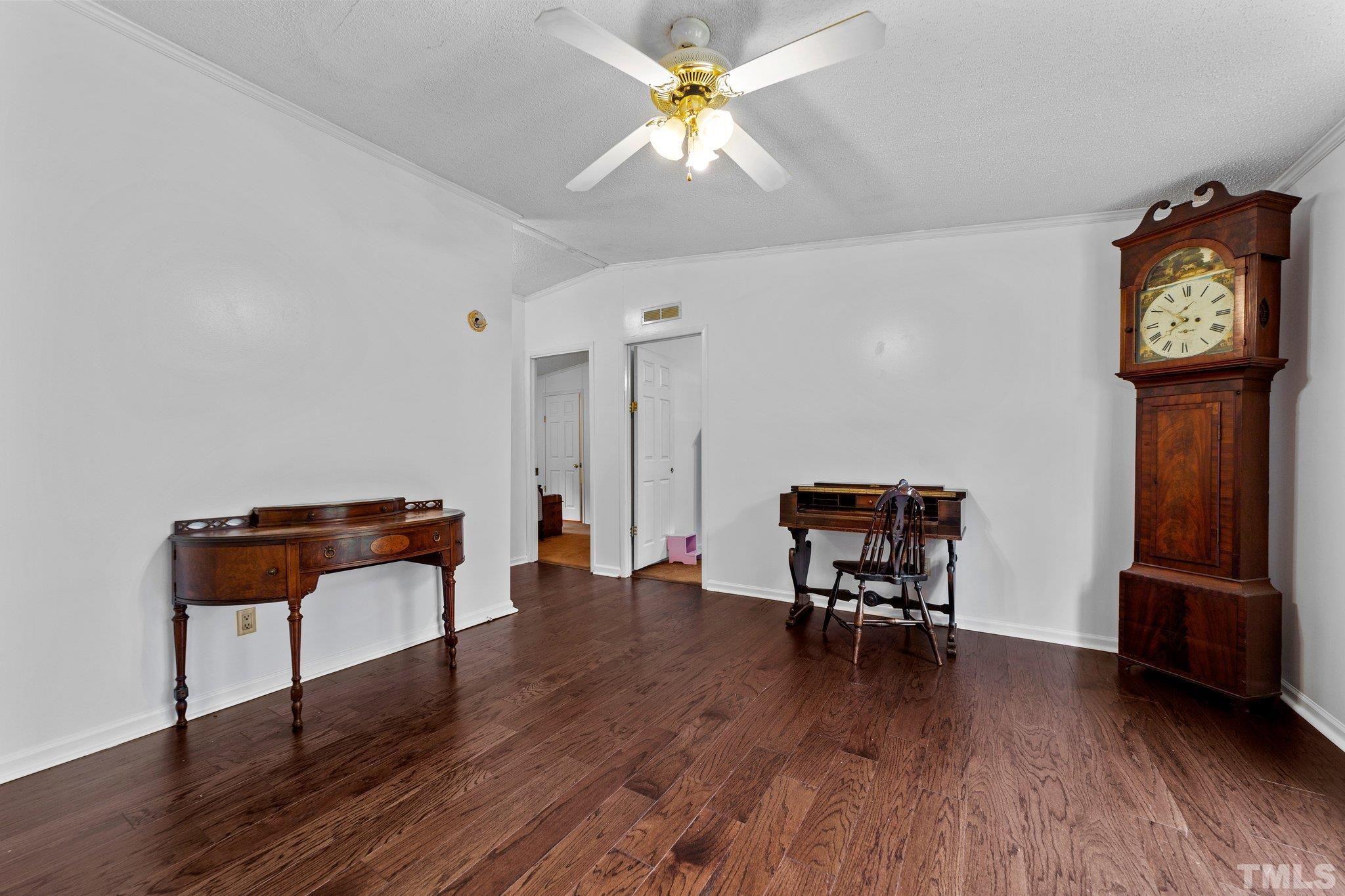 9617 Jernigan Road Spring Hope, NC 27882 - Photo 20 of 41 a living room with furniture and a wooden floor